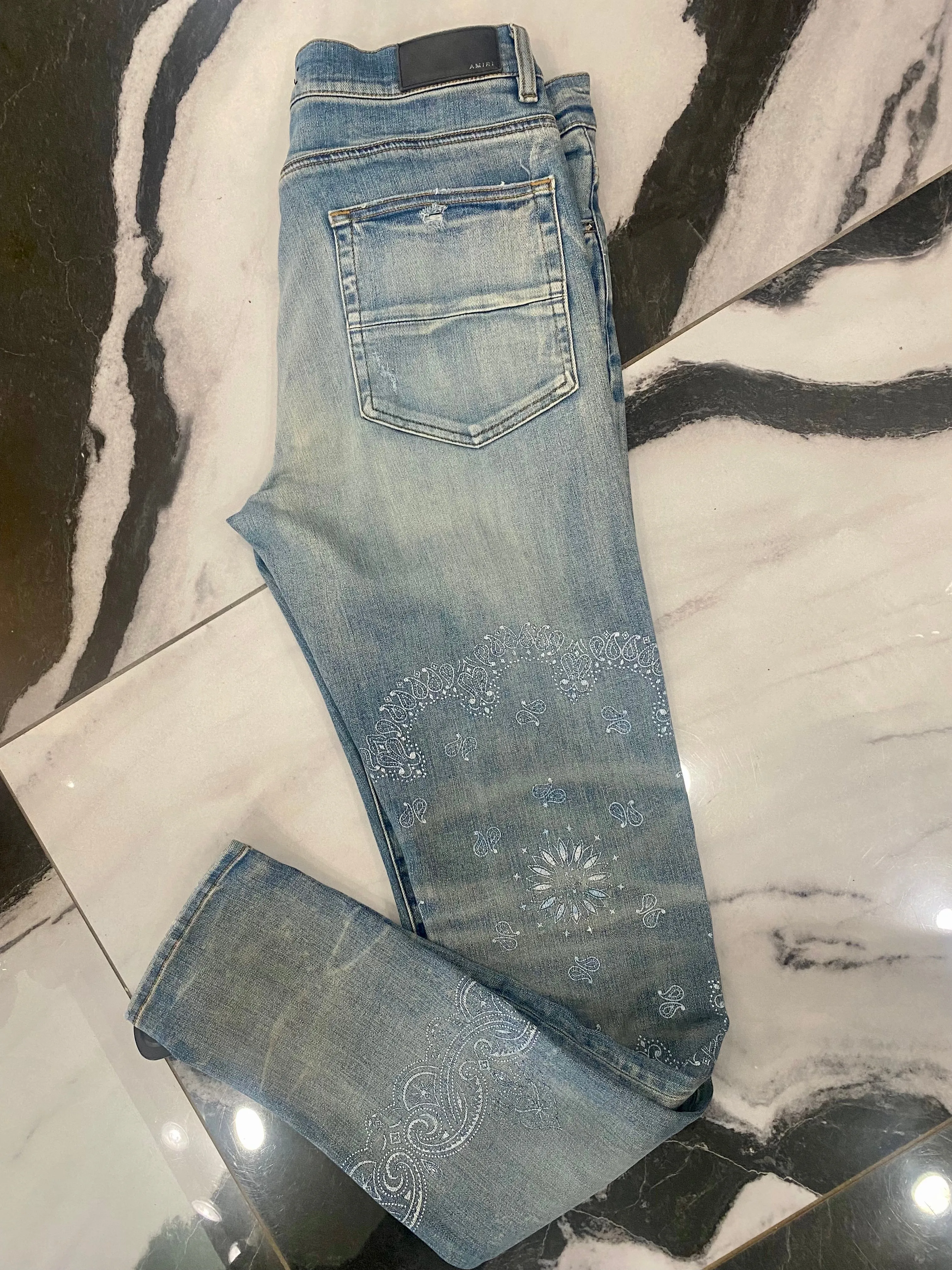 AMIRI DISTRESSED SCREEN PRINT BANDANA JEANS