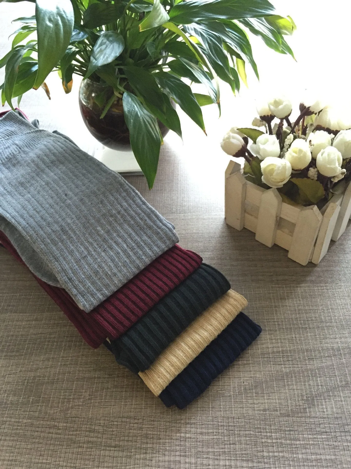 Over piles of stockings knit socks